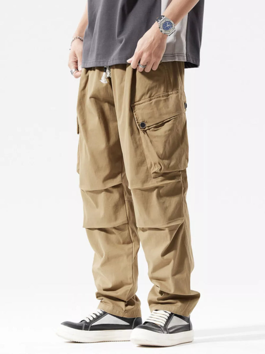 Men's khaki loose fit cargo sweatpants with drawstring and multiple pockets.