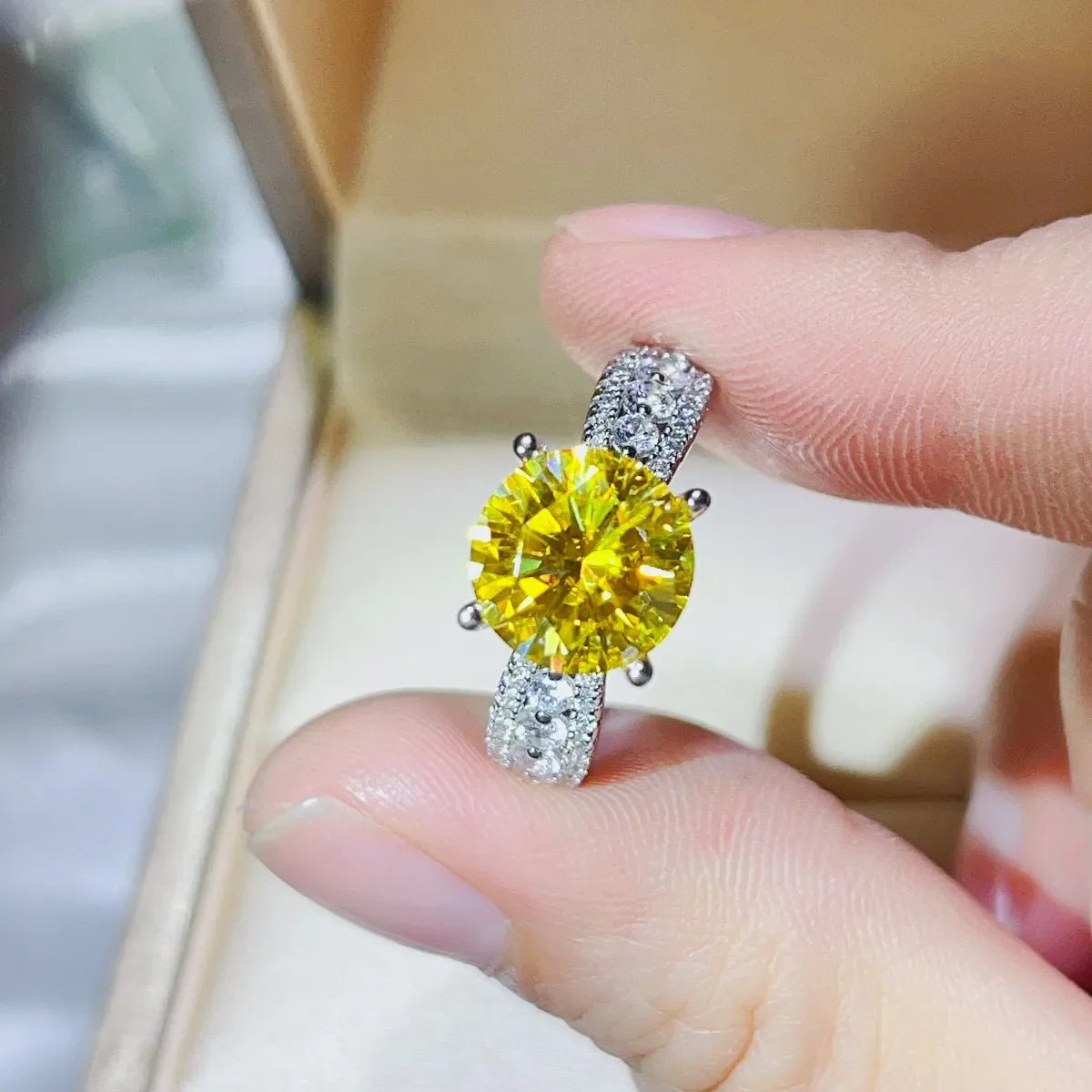 Radiant canary moissanite pavé band ring with a large yellow center stone.