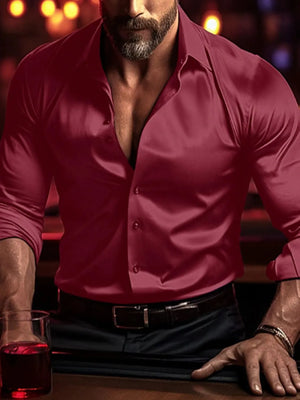 Burgundy satin shirt with a sculpted fit and open collar, worn by a man.