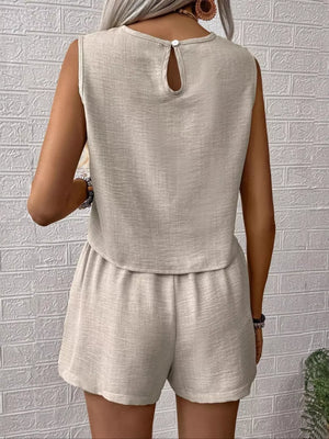 Beige sleeveless V-notch top with button back and elastic waist shorts set.