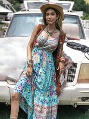 Floral tiered cami maxi dress with tassels and a tie waist in a blue floral print.