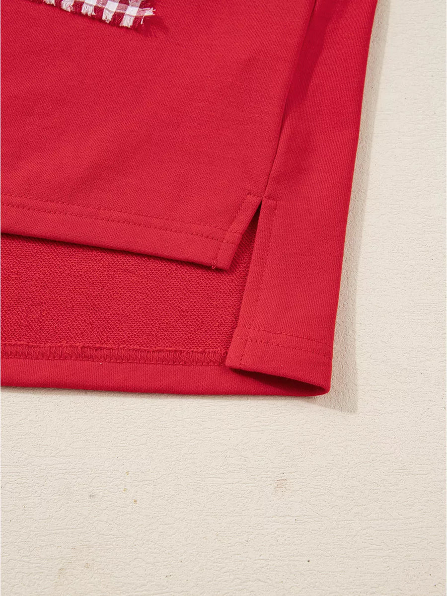 Red cotton sweatshirt with side slits and a festive plaid detail.