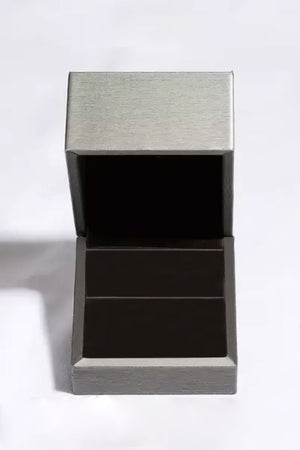 Open jewelry box with brushed silver lid and dark interior