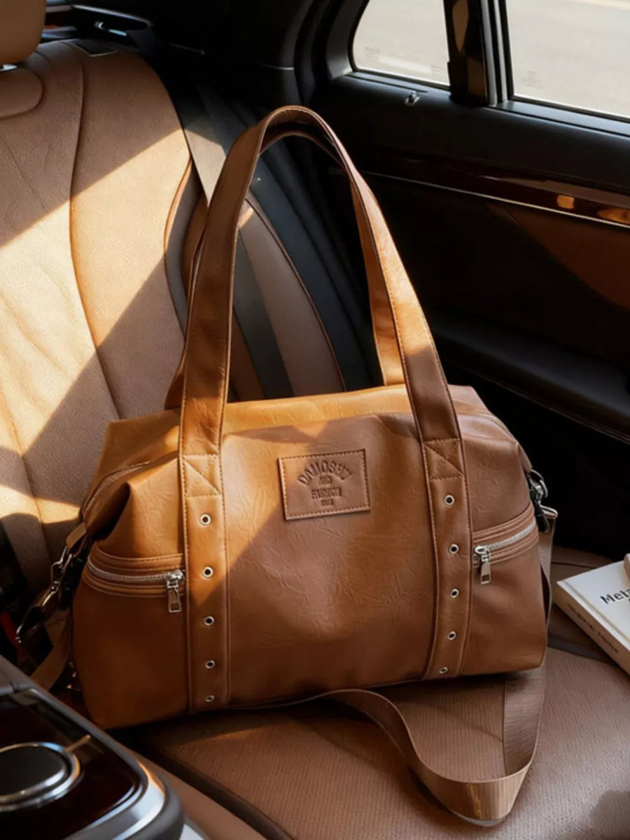 Chic brown pu leather shoulder bag with adjustable strap and silver hardware details.