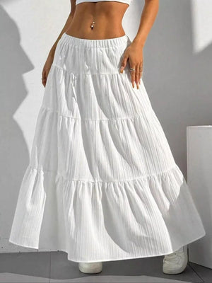 White tiered maxi skirt with elastic waistband and textured fabric