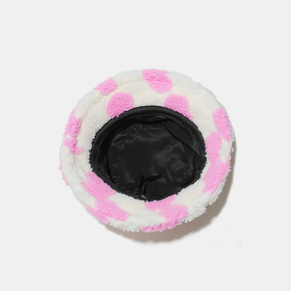 Pink polka dot fuzzy sherpa bucket hat with black lining
