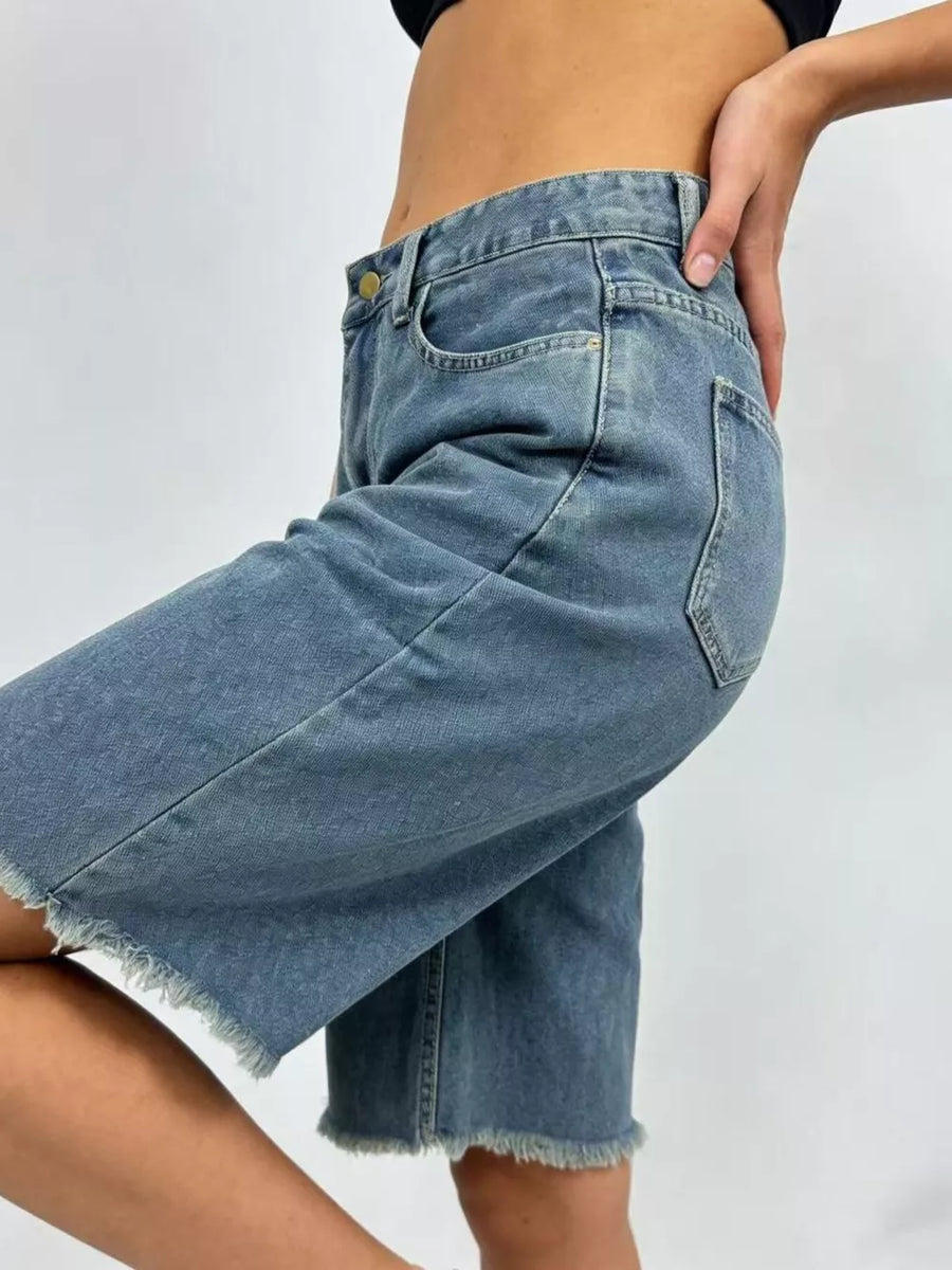 Blue denim bermuda shorts with frayed hem and belt loops