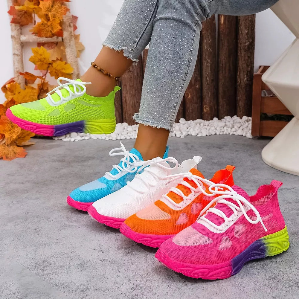 Breathable mesh lace-up sneakers in orange red, sky blue, white, and rose red with gradient soles.