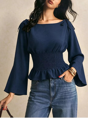 blouse in navy blue featuring ruffled and fitted fit