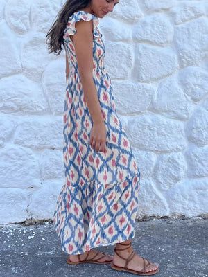 Smocked ruffle sleeve maxi dress with blue and pink ikat print and tiered skirt.