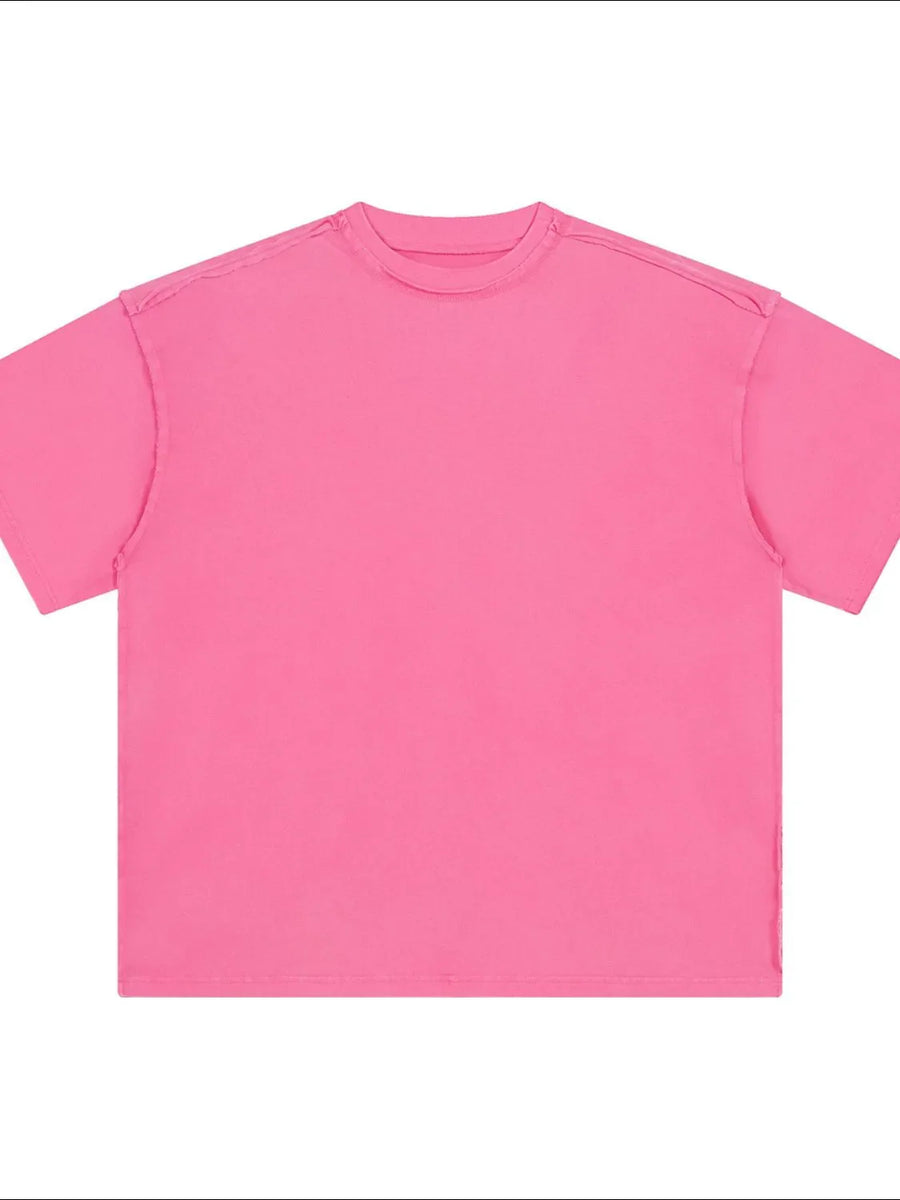 Hot pink washed cotton tee with raw seams and crew neck.