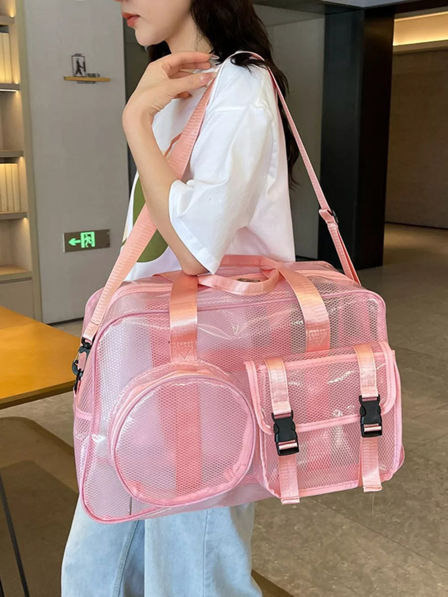 Pink mesh travel organizer bag with multiple pockets and buckle closures.