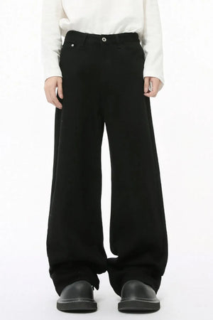 Black balloon leg jeans with a faded wash and wide silhouette.
