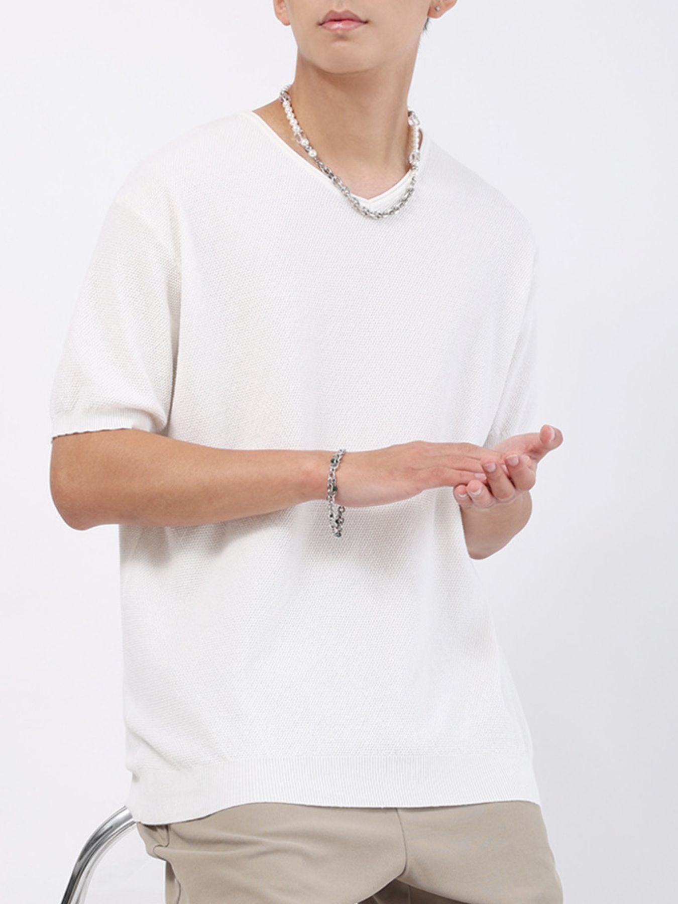 Men's white casual knit t-shirt with a textured weave and short sleeves.