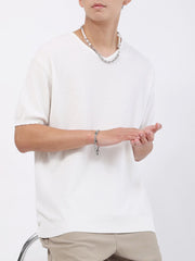 Men's white casual knit t-shirt with a textured weave and short sleeves.