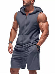 Men's dark gray sleeveless zip-up hoodie and shorts activewear set with front pockets.
