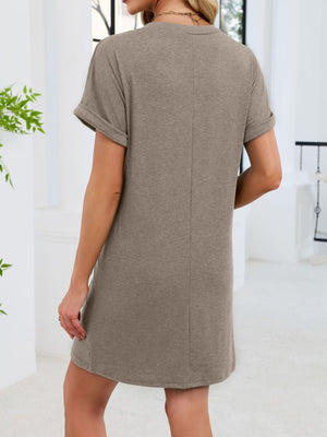 Slightly stretchy v-neck t-shirt dress in coffee with cuffed short sleeves and above-knee length.