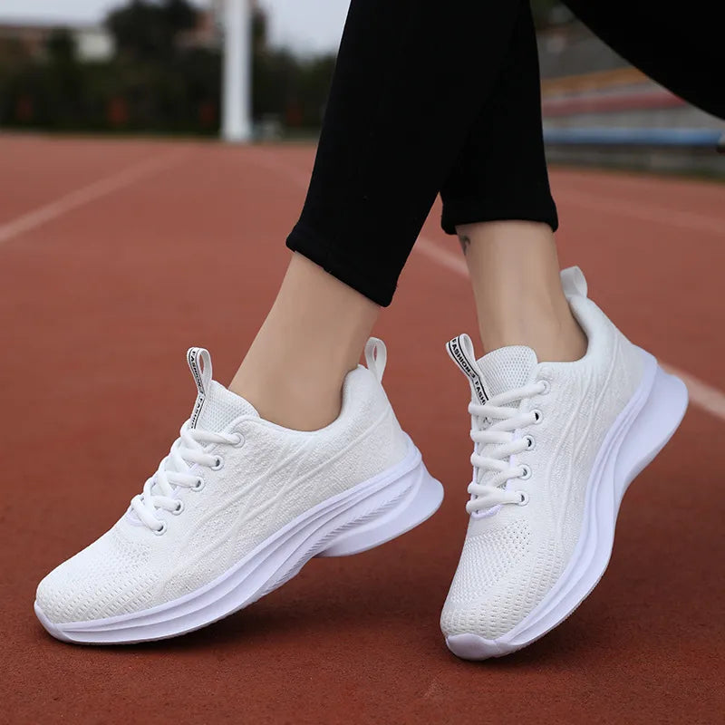 White textured knit performance runners with white laces and soles.