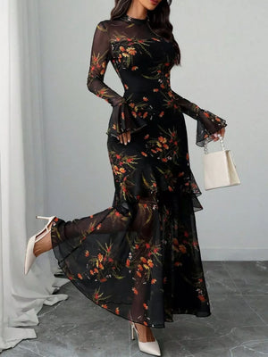 Black floral mermaid maxi dress with sheer flounce sleeves and tiered ruffles.