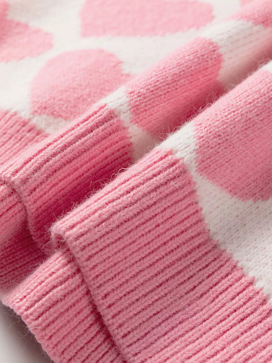 Charming Heart Pattern Knit Sweater in blush pink and white acrylic, featuring ribbed cuffs and hem detail.