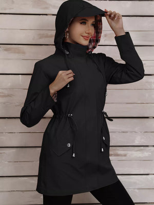 Black drawstring trench coat with plaid lining and snap-down pockets.