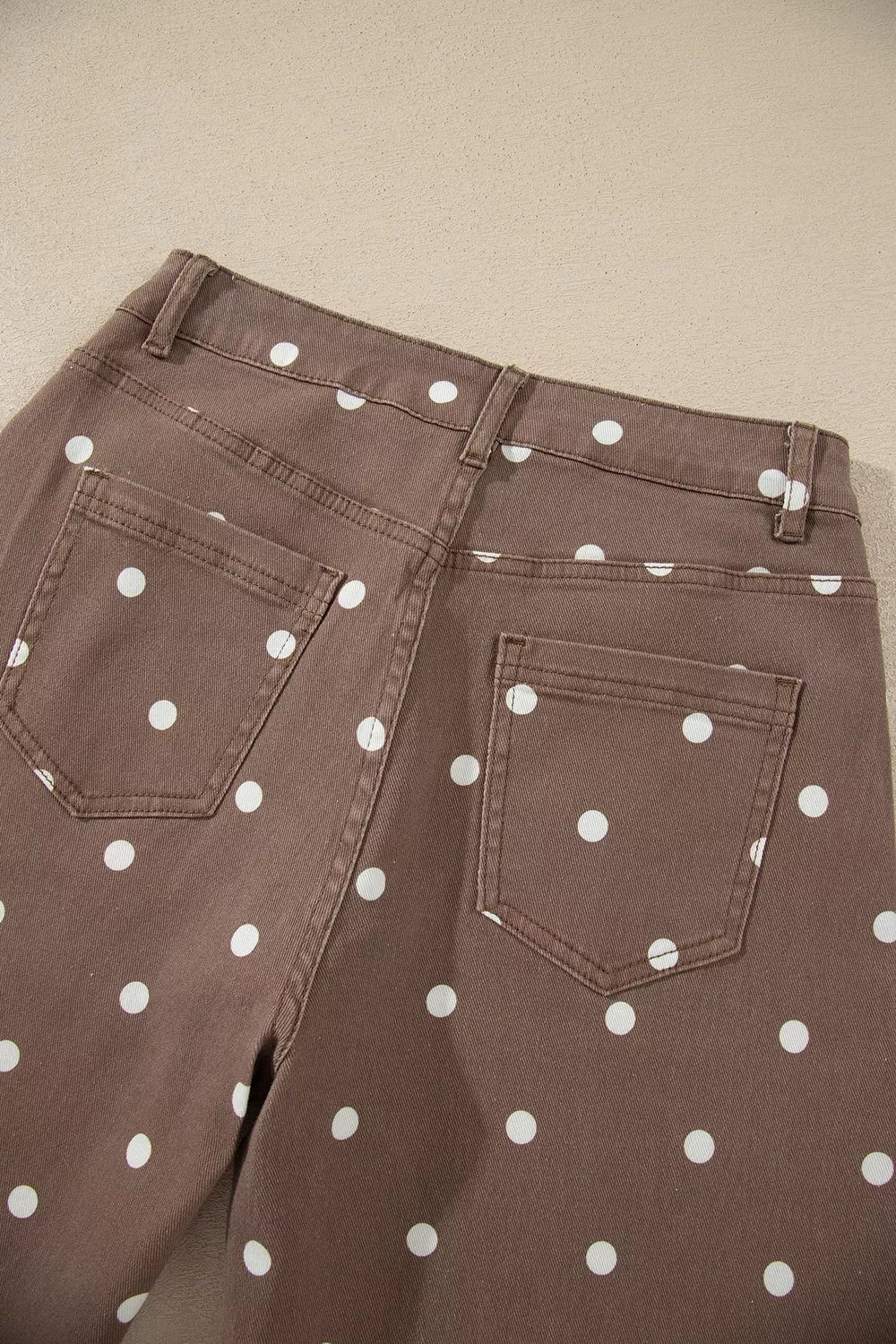 white jeans with zip-front and polka dot