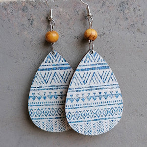 Teardrop earrings with blue tribal pattern and wood bead detail