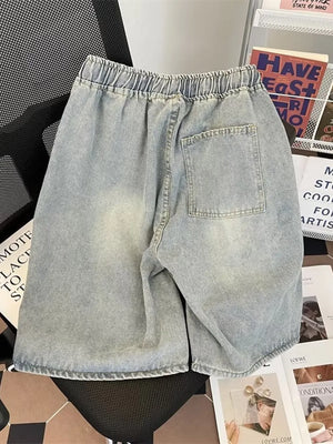 Light blue distressed denim shorts for men with elastic drawstring waist and back pocket.