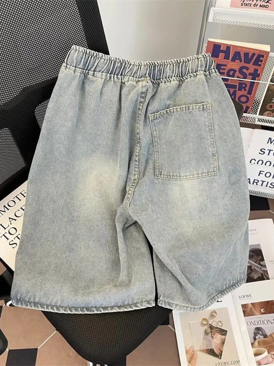 Light blue distressed denim shorts for men with elastic drawstring waist and back pocket.