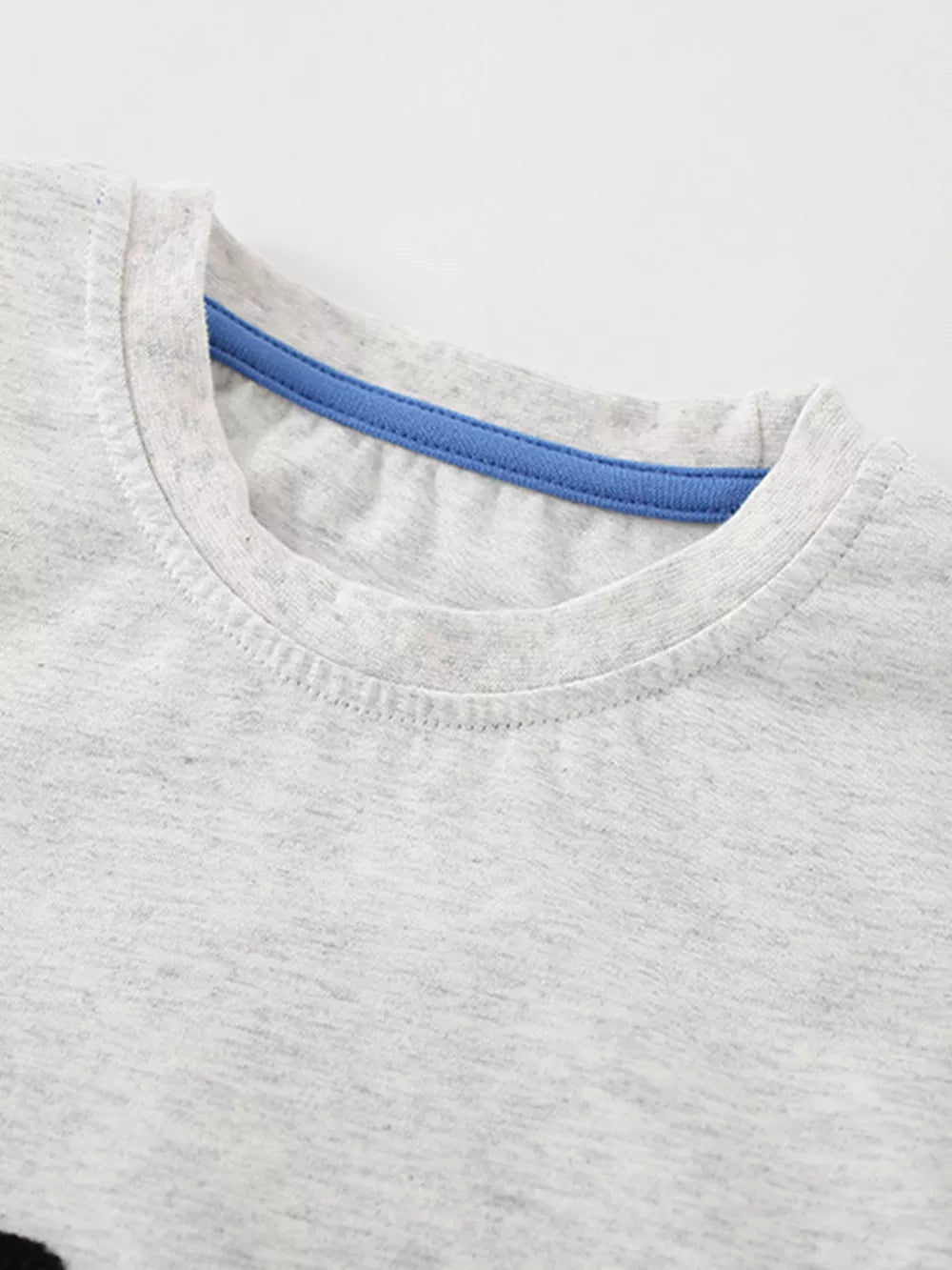 Toddler grey cotton t-shirt with blue neck trim and graphic detail.