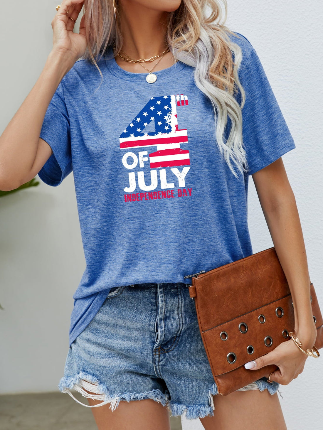 Cobalt blue graphic tee with 4th of July print, crew neck, short sleeves.