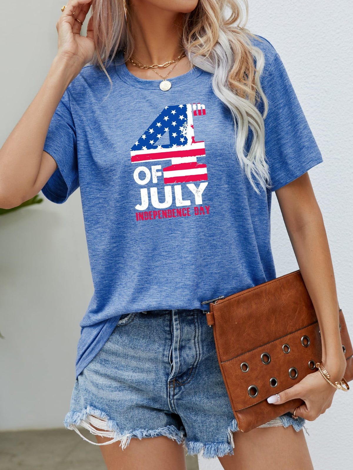 Cobalt blue graphic tee with 4th of July print, crew neck, short sleeves.
