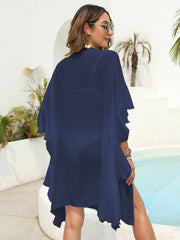 Dark blue polyester beach kimono with cascading ruffles and a flowing silhouette.