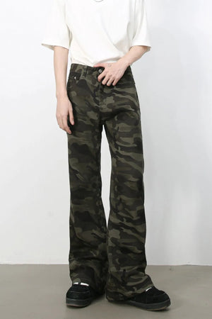 Camo flare denim trousers in green camouflage pattern.