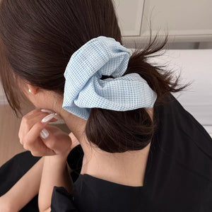 light blue scrunchie with elastic and gingham, plaid, striped