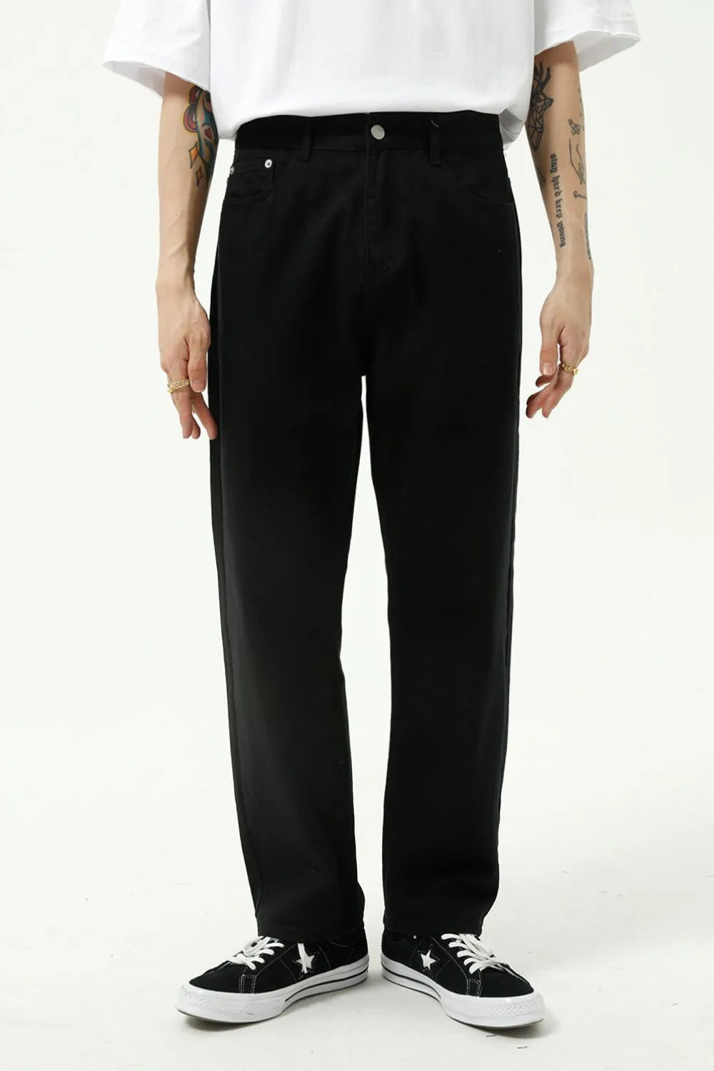 Black relaxed fit denim trousers with a straight leg cut.