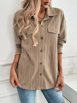 Camel utility jacket with textured diamond weave, buttoned front and chest pockets.