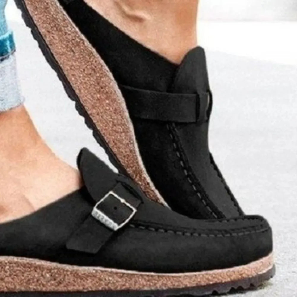 Black suede buckle mule loafers with cork sole detail