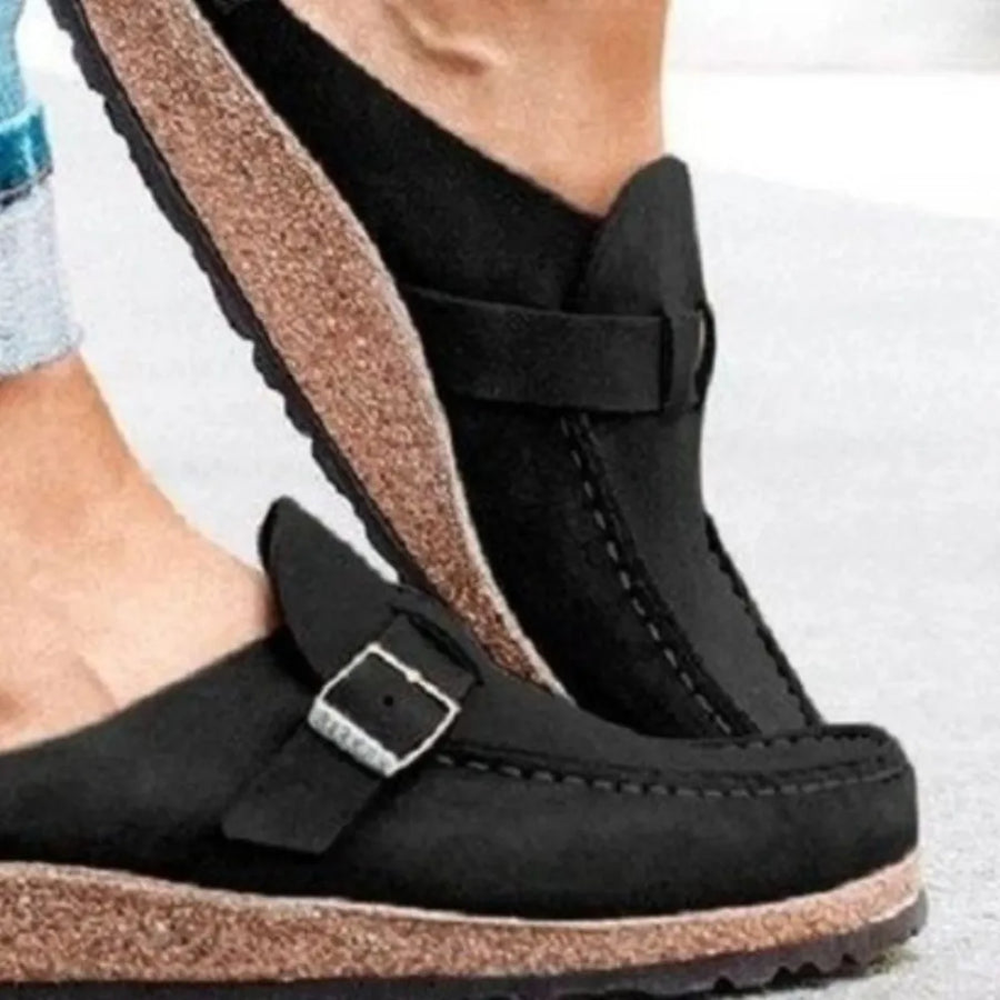 Black suede buckle mule loafers with cork sole detail