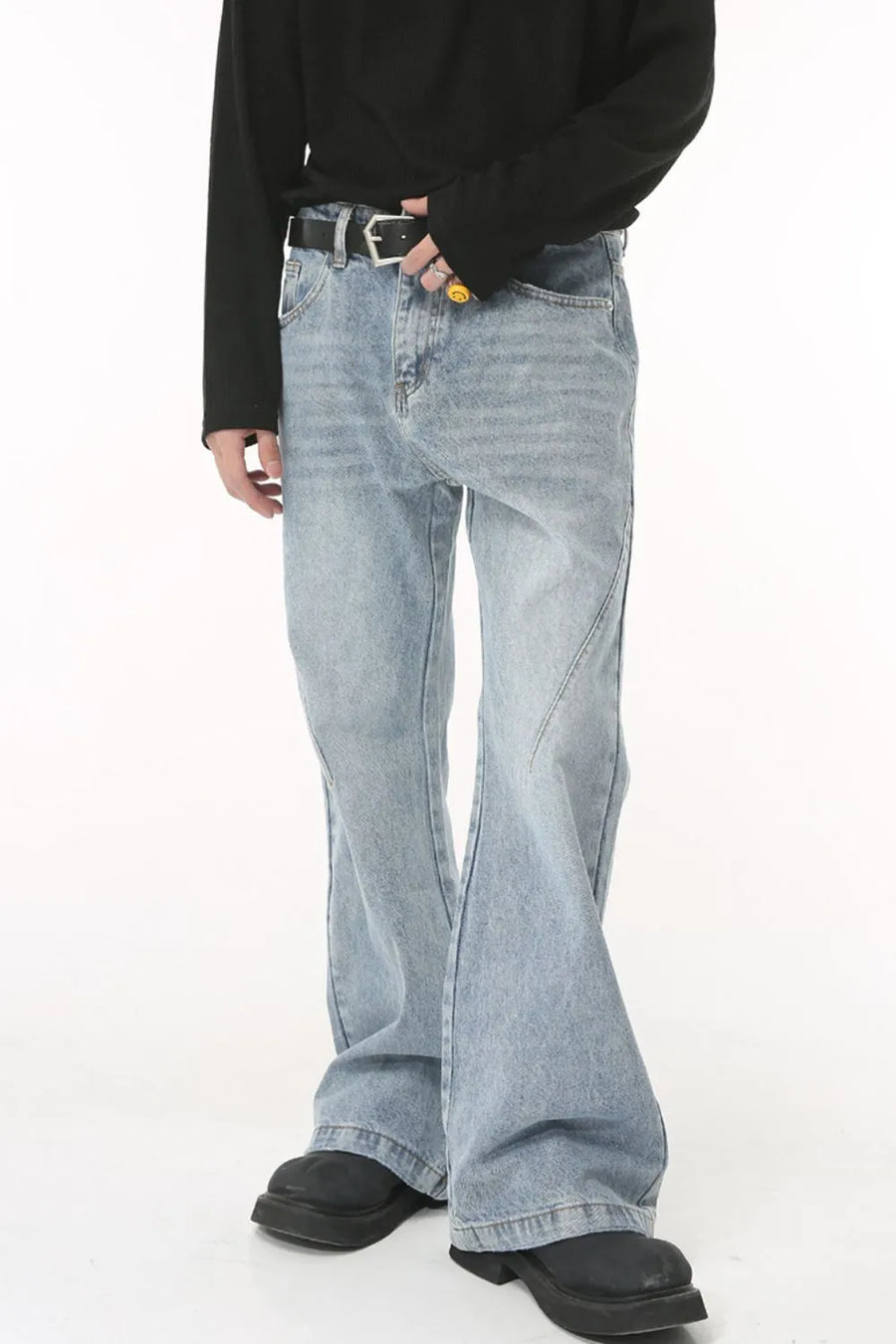Medium wash flared denim jeans with sculpted seam detail