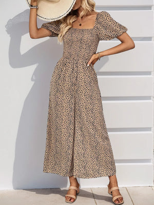 Smocked bodice leopard print jumpsuit with puff sleeves and wide legs in tan.