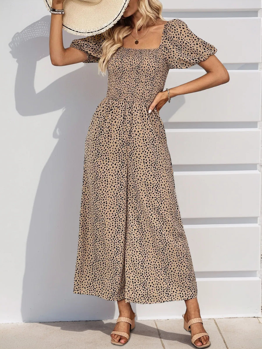 Smocked bodice leopard print jumpsuit with puff sleeves and wide legs in tan.
