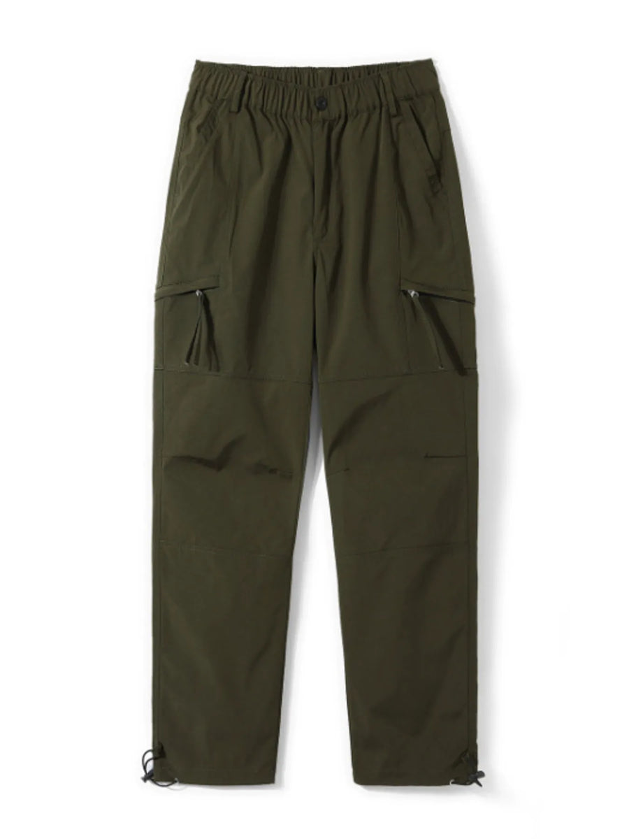Relaxed fit green cargo pants with multiple zippered pockets and adjustable ankle cuffs.