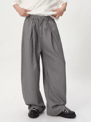 Plaid wide-leg relaxed fit pants in grey with adjustable drawstring waist.