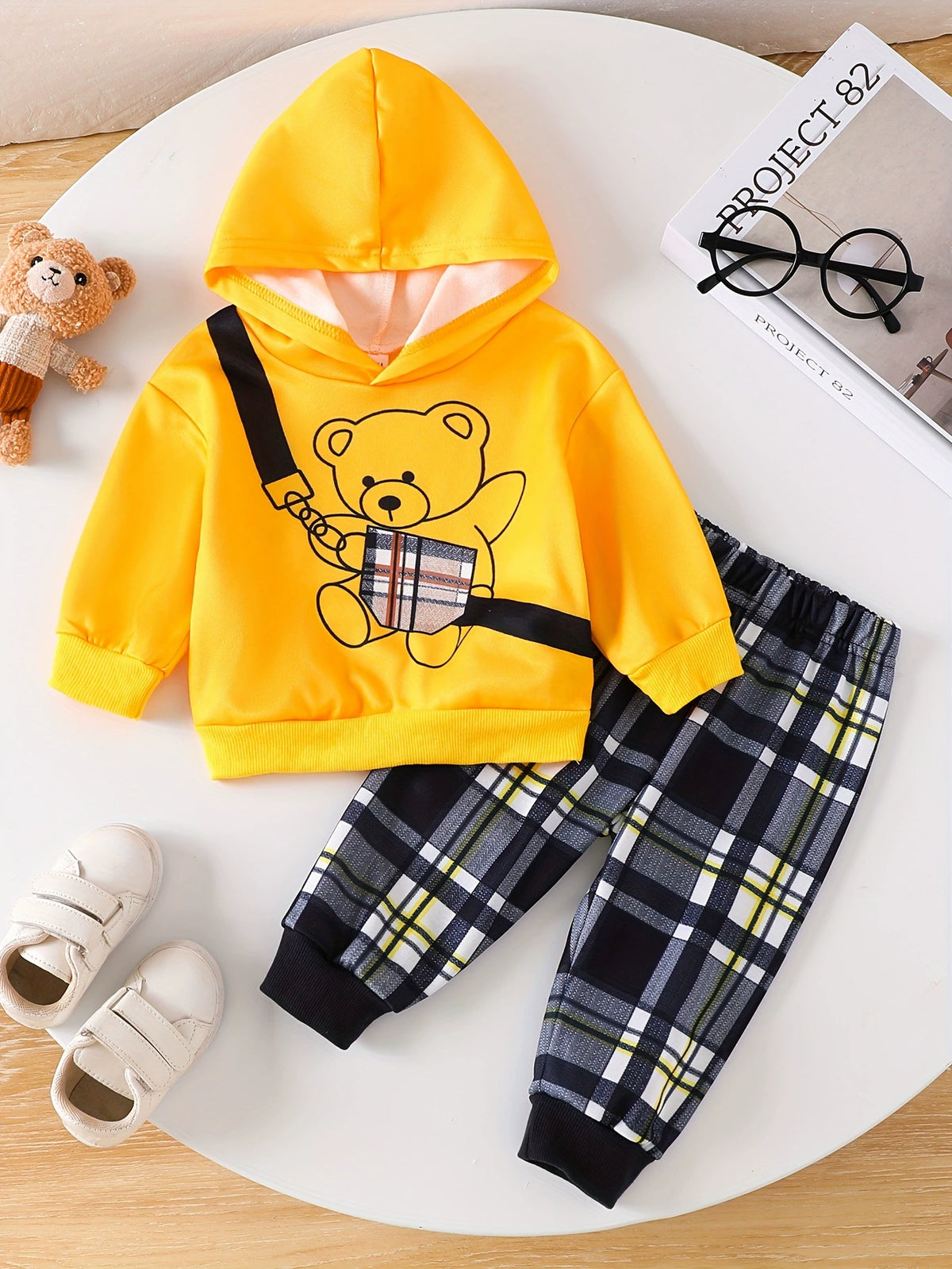 Yellow bear graphic hoodie and black plaid pants set for baby.