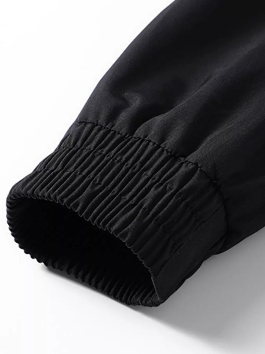 Black bomber jacket sleeve detail with ribbed elastic cuff
