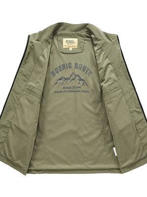 Men's plus size sage green multi-pocket vest, interior view with "Scenic Route" mountain graphic.
