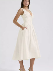 Cream V-neck midi dress with gathered bust and A-line skirt with pockets.