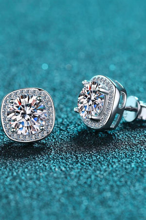 Silver cushion cut halo moissanite stud earrings with sparkling center stones.