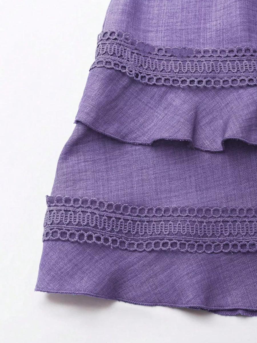 Purple mini dress with tiered ruffles and lace trim detail